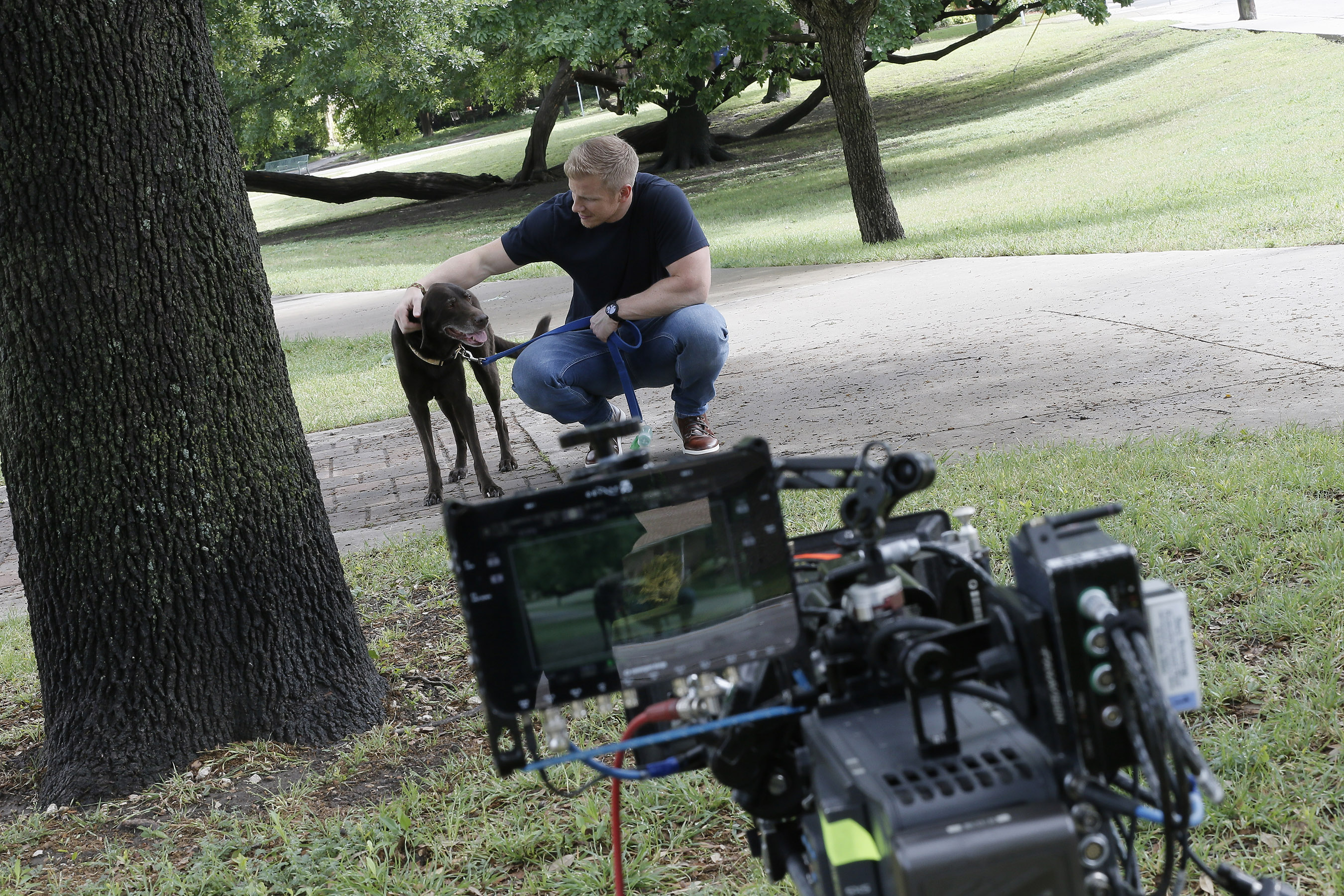 TV personality and Hurricane Harvey responder, Sean Lowe, takes a break from filming a PSA on pet disaster preparedness with the Banfield Foundation to give his beloved dog, Ellie, some love. The PSA debuted nationally on Wednesday, June 6, 2018, and educates pet owners on the simple yet potentially life-saving steps they can take for their pets before the next disaster strikes. (Photo credit: Brandon Wade/AP Images for the Banfield Foundation)
