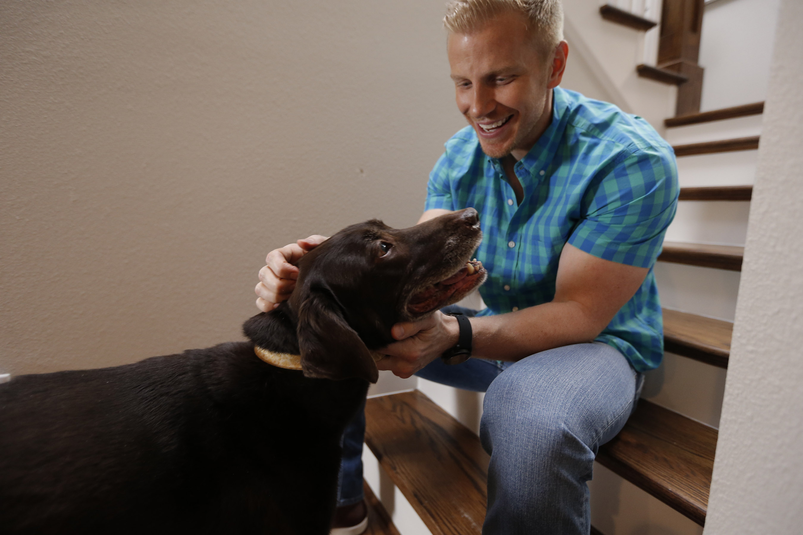 TV personality and Hurricane Harvey responder Sean Lowe shares a moment with his beloved dog, Ellie, while filming a pet disaster preparedness public service announcement (PSA) with the Banfield Foundation at his home in Dallas, Texas. The PSA debuted nationally on June 6, 2018 and educates pet owners on the importance of including pets in disaster planning. (Photo credit: Brandon Wade/AP Images for the Banfield Foundation)