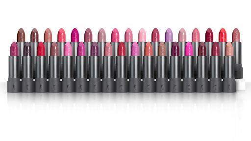Lipsticks of various colors stood upright in two rows.