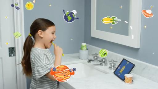 Video of a kid playing the new Dixie Molar Monsters augmented reality app while brushing her teeth.