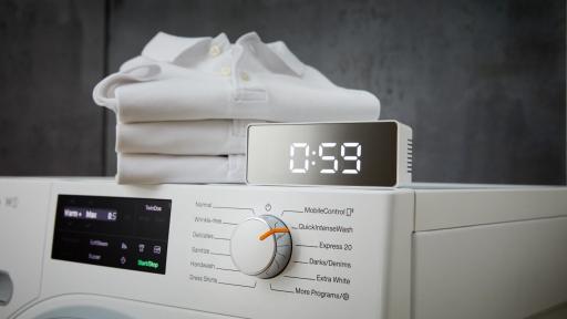 A timer with 59 minutes sits on top of the W1 series washing machine with a selection nob pointing to Quick Intense Wash.