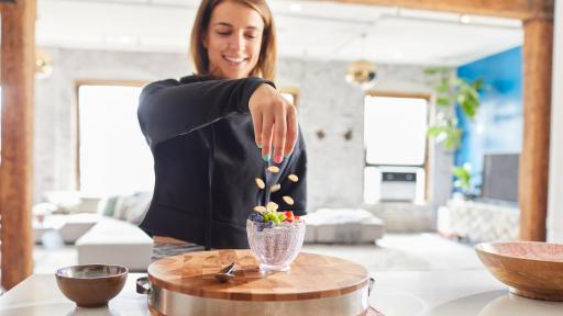 Victoria Arlen topping off milk chia pudding with California Almonds
