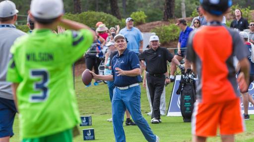 Mark Rypien throwing a football on the golf course while spectators watch