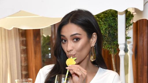 Shay Mitchell drinking a fruity drink