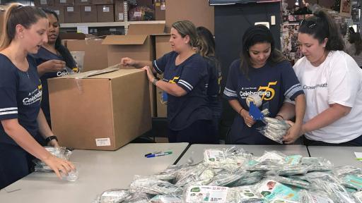 Crowe personnel compile care packages.