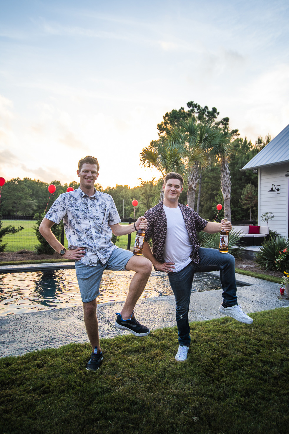 Adam Devine and Tyler Tills strike Captain Morgan’s iconic one-legged pose at Tyler’s surprise 30th birthday party.