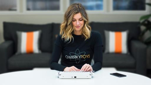 Image of woman with the Qwerkywriter keypad.