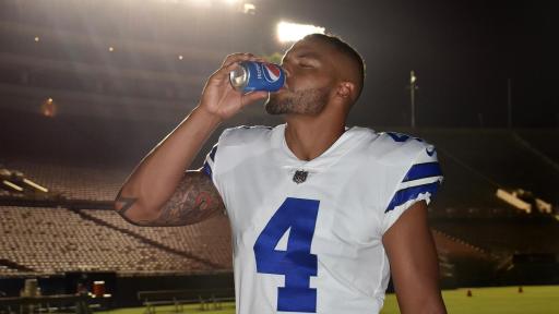 Football player drinking a Pepsi