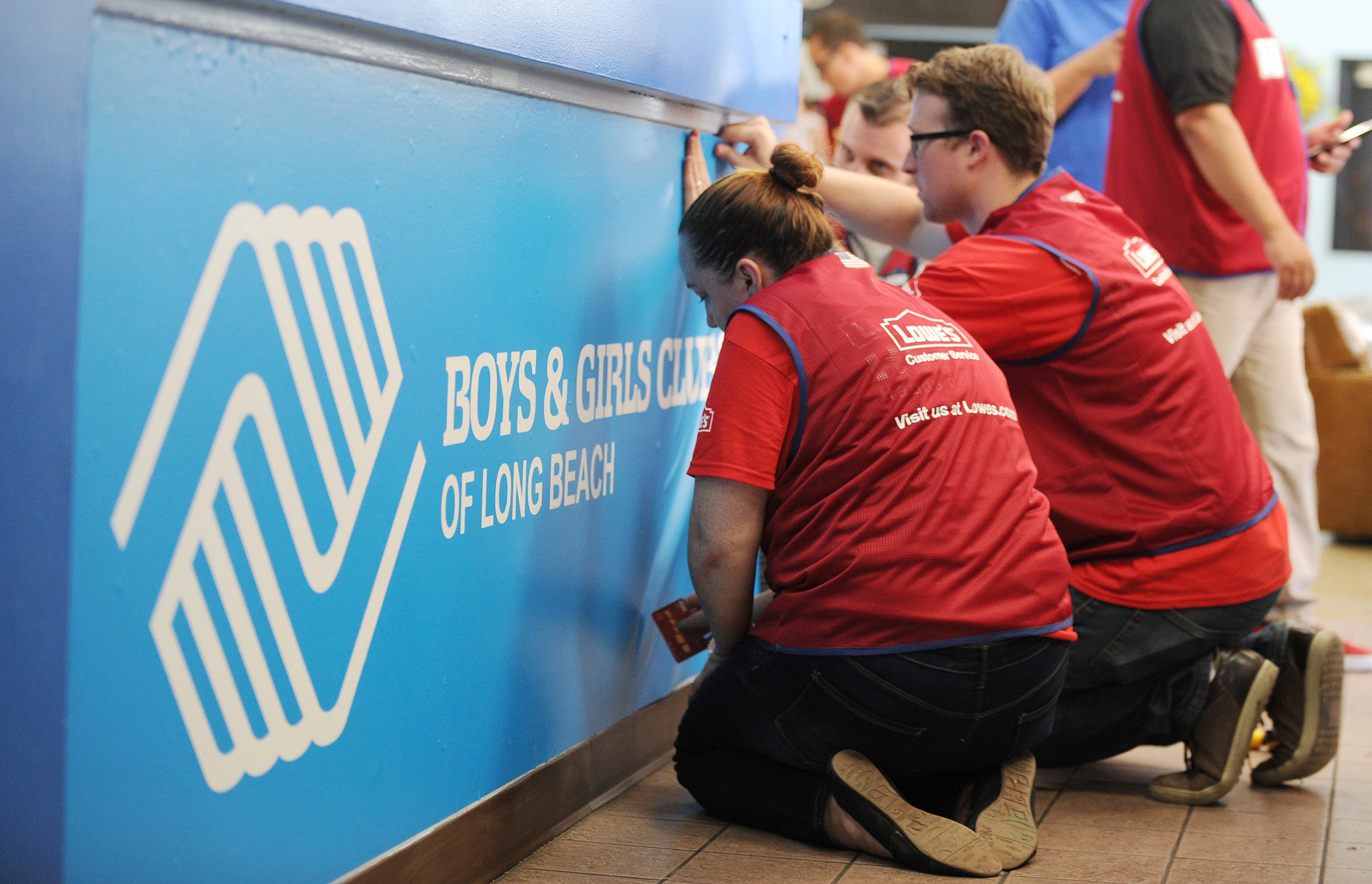 Lowe's Heroes, the retailer's employee volunteer force, work to spruce up the Fairfield/Westside Boys & Girls Club with new paint, blinds, furniture, and outdoor landscaping projects.