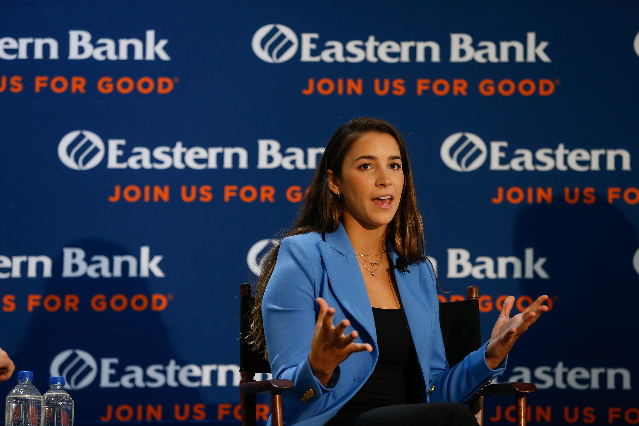 Aly Raisman, Eastern Bank's newest Partner for Good, addresses a crowd in Boston on October 16, 2018.