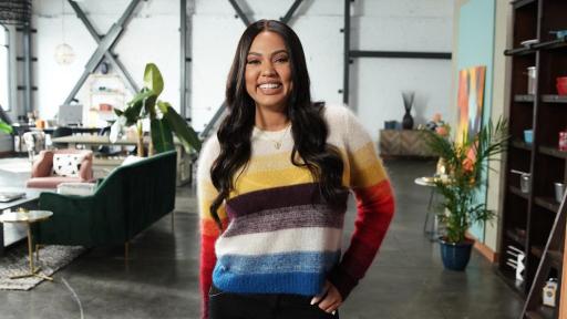 Ayesha Curry standing in an office