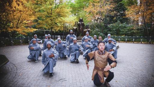 People dressed as terracotta warriors perform a pose of the Terracotta Army in Central Park