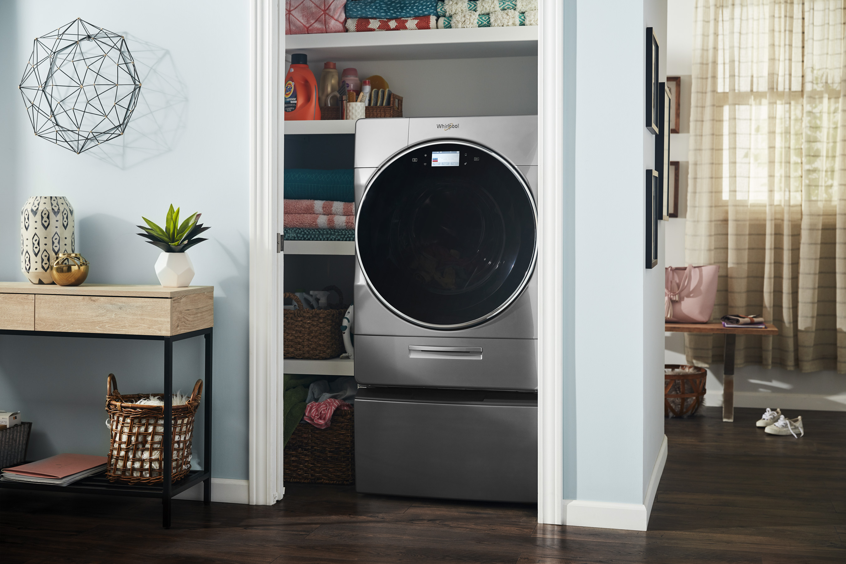 The Whirlpool® Smart All-In-One Washer & Dryer completes a load of laundry in the same machine.