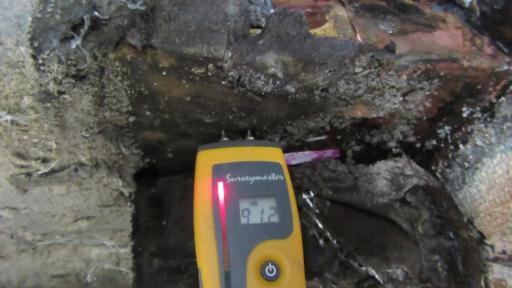 Elevated moisture levels detected at stairs, showing waterproofing failure.
