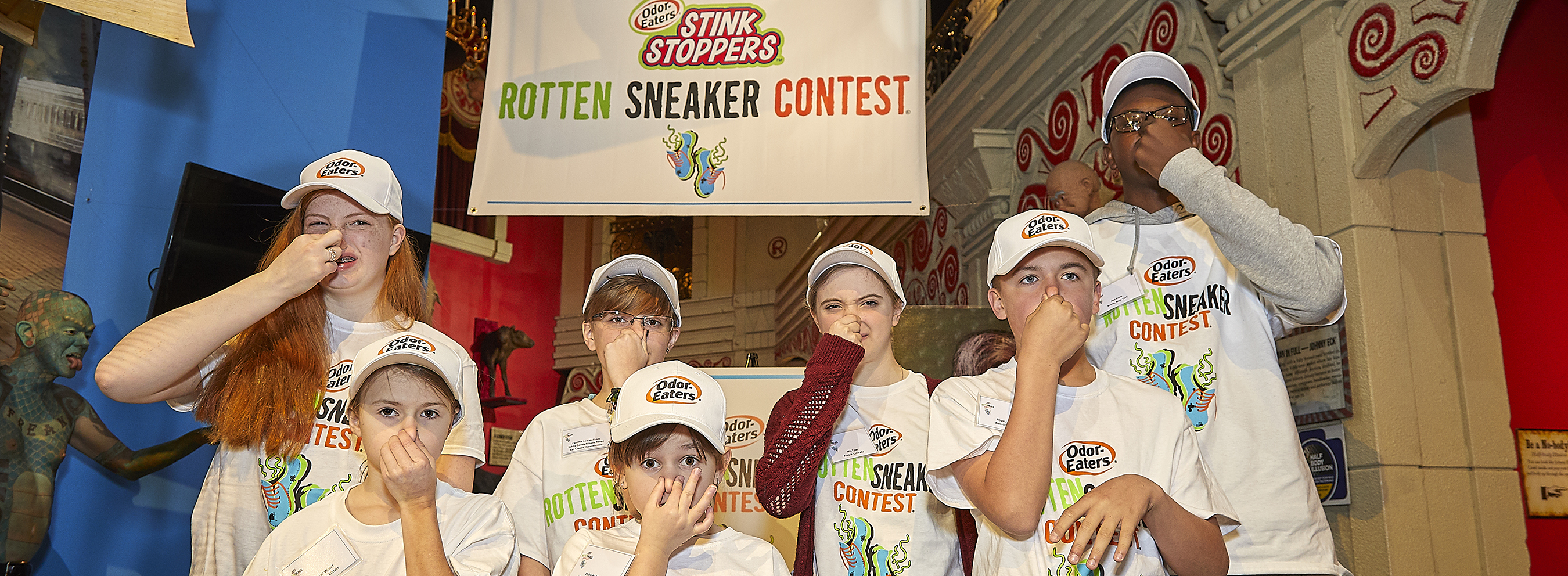 Contestants of the Rotten Sneakers contest plugging their nose.