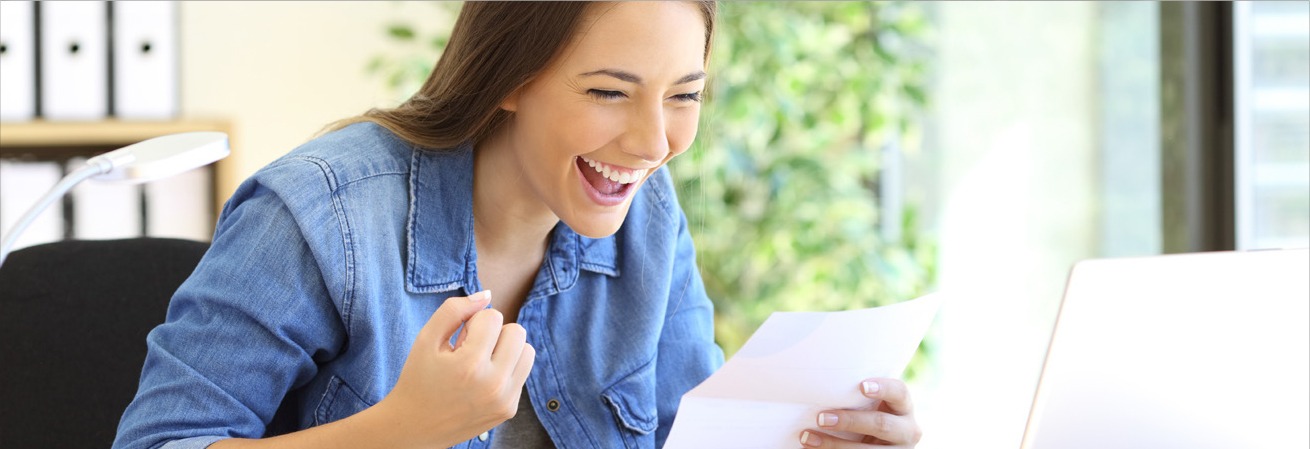 woman smiling looking at paper