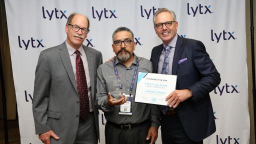 Leonard Leanos of Waste Management San Gabriel holding award for Lytx Driver of the Year