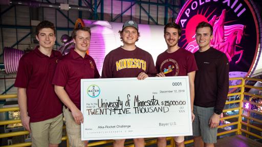 The winning rocket team from the University of Minnesota holds the $25,000 prize check provided by Bayer following the 2019 Alka-Rocket Challenge on Thursday.