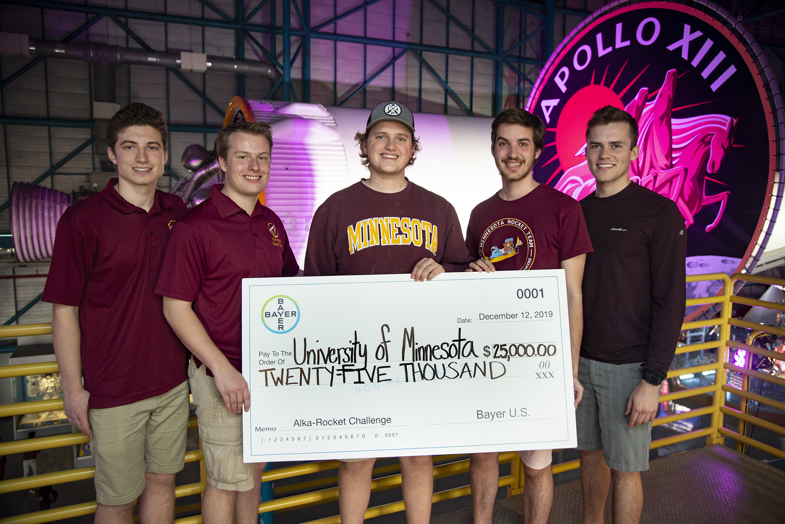 The winning rocket team from the University of Minnesota holds the $25,000 prize check provided by Bayer following the 2019 Alka-Rocket Challenge on Thursday.