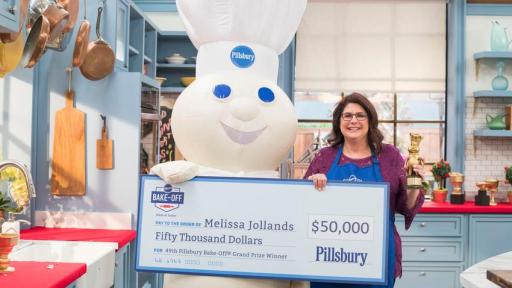 Melissa and doughboy holding large check
