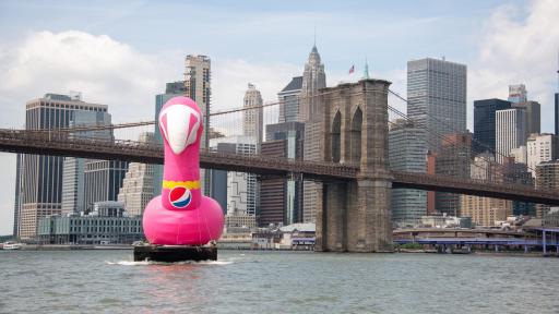 “Always Pool Ready” Pepsi #Summergram Flamingo floatie in front of the Brooklyn Bridge