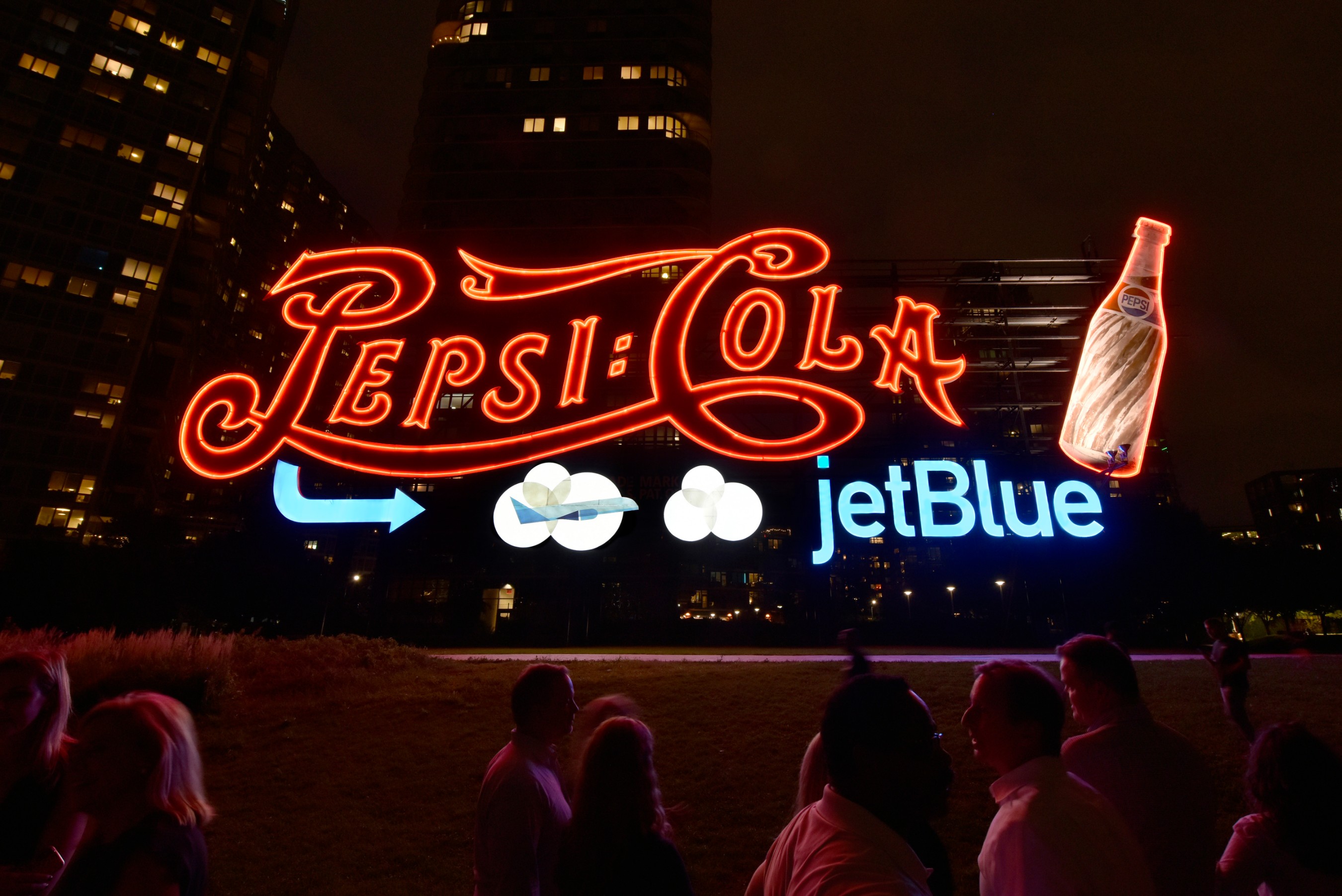 PepsiCo and JetBlue light up the sky in Long Island City, New York in celebration of the new partnership between these two New York-based companies. For the first time ever, PepsiCo temporarily added JetBlue branding to its world-famous Pepsi-Cola sign, which will be visible to New Yorkers and visitors through September.