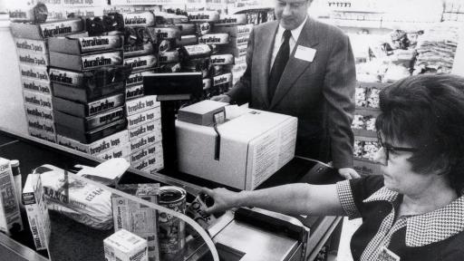 Black and white photo of a checkout lane 1970s Checkout