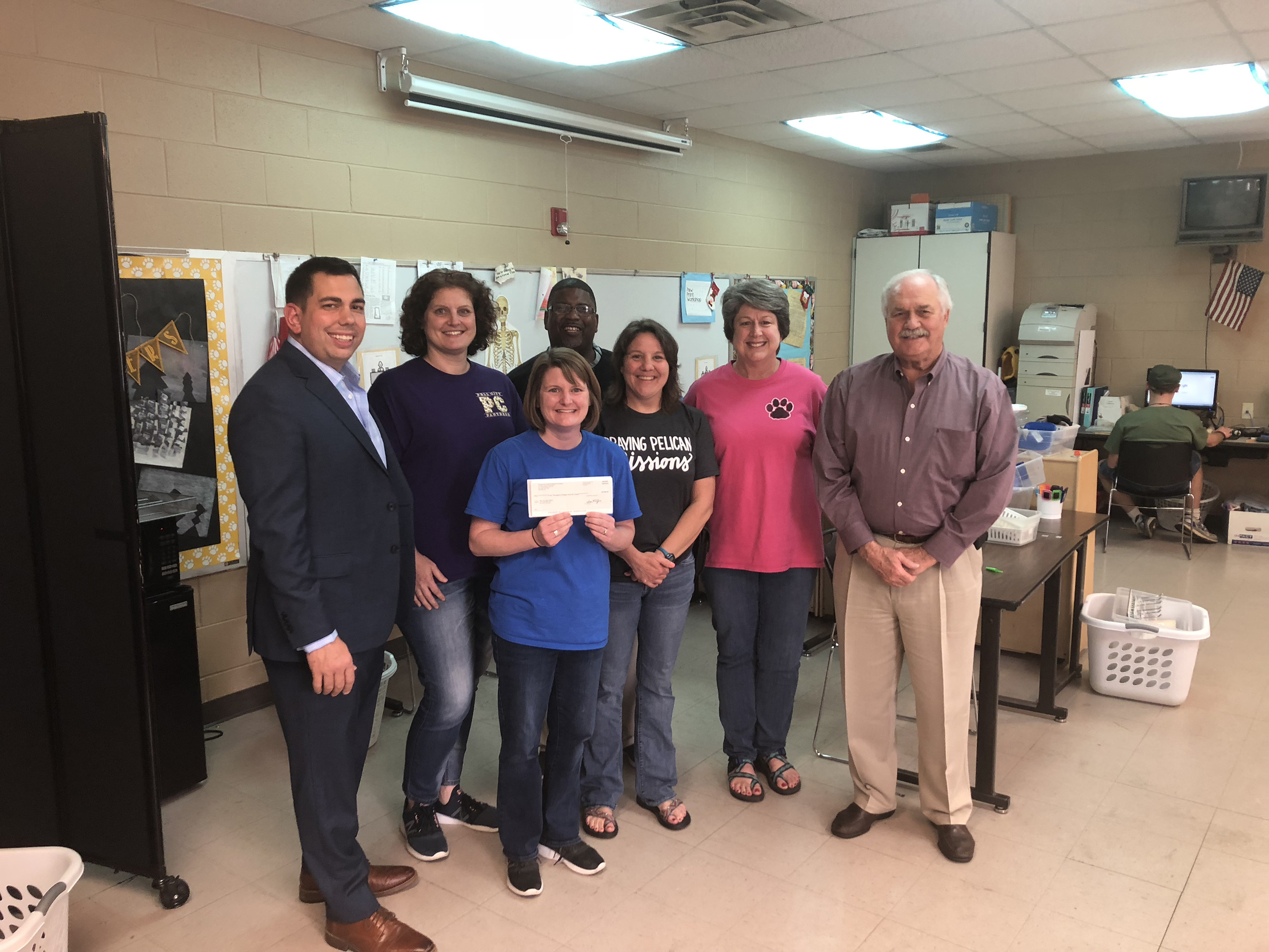 The $5,000 CenturyLink grant awarded to Pell City (Alabama) High School will be used in a project titled “Accessing Digital Learning with Chromebooks.” Accepting the grant check are (from left) Brent Beal, Christy Gunn, winning teacher Amy Beck, Jackie Wyche, Windy Jones, Kelly Smith and Alabama State Representative Randy Wood.
