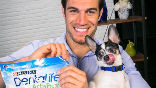 Evan Antin with dog and DentaLife product