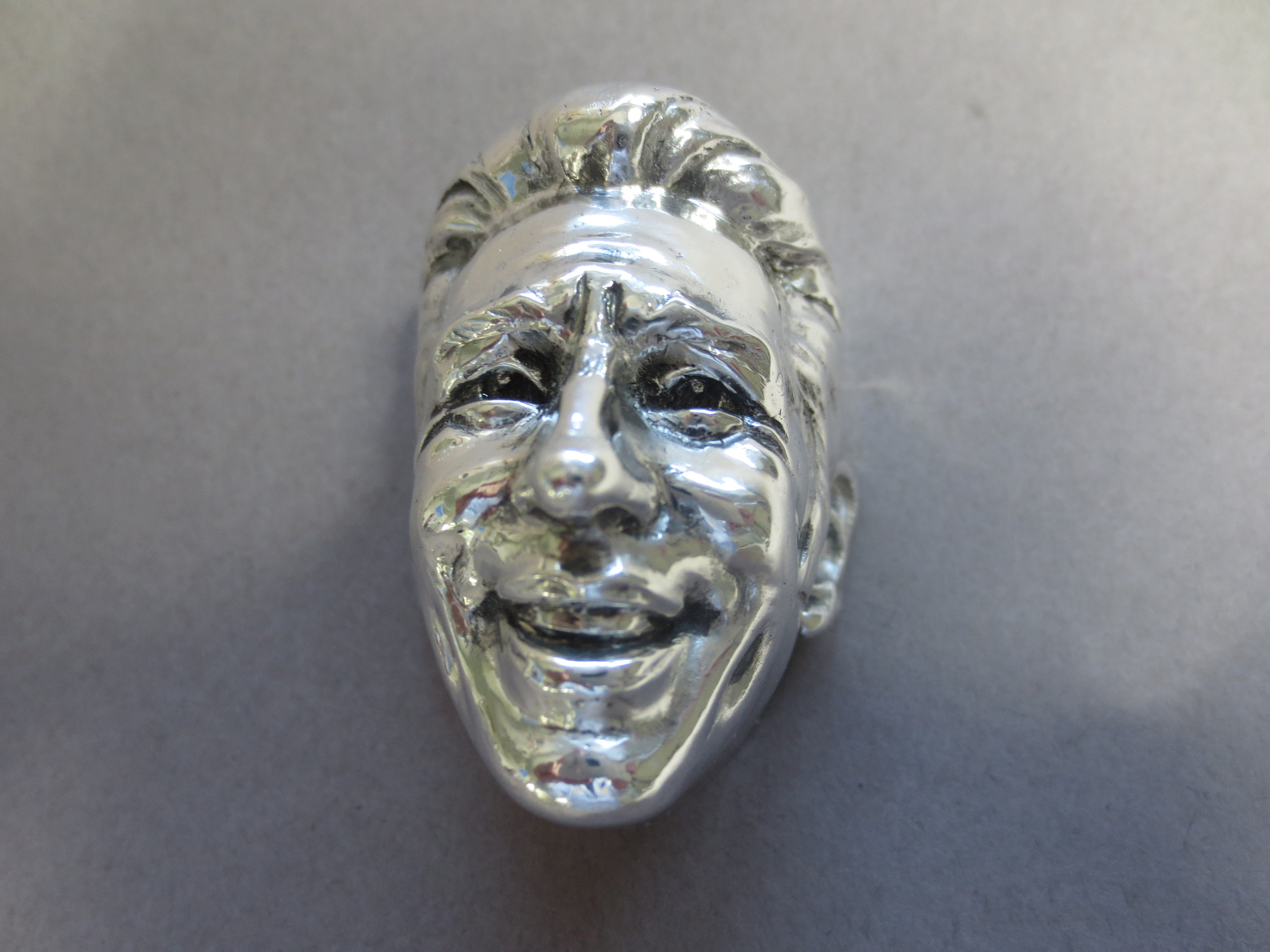 The sterling silver sculpture of Mario Andretti for his Baby Borg trophy commemoration the 50th anniversary of his Indianapolis 500 win.