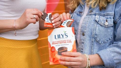 People sharing a bag of Lily's Sweets Peanut Butter Cups