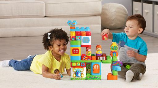Children play with the ABC Smart House blocks