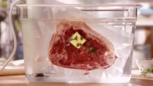 Steak in a plastic bag in an ice bath.