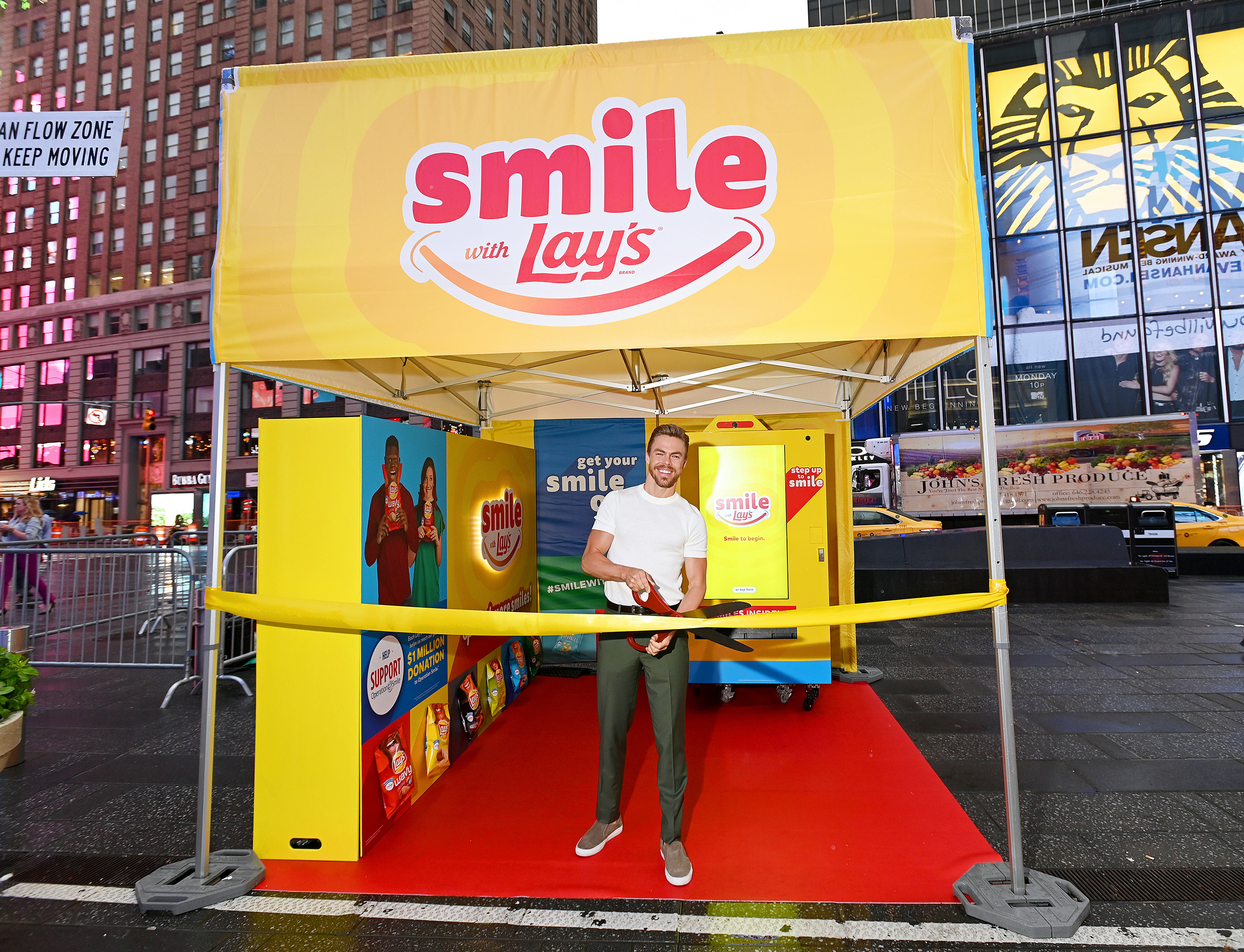 Dancer, actor and singer Derek Hough kicks off the Lay’s Smiles campaign by unveiling the first-ever Smiles Station in Times Square, New York City, on July 23, 2019. The station dispenses Lay’s limited-edition bags to passerby featuring real people’s stories and smiles aimed at helping raise $1 million to Operation Smile.