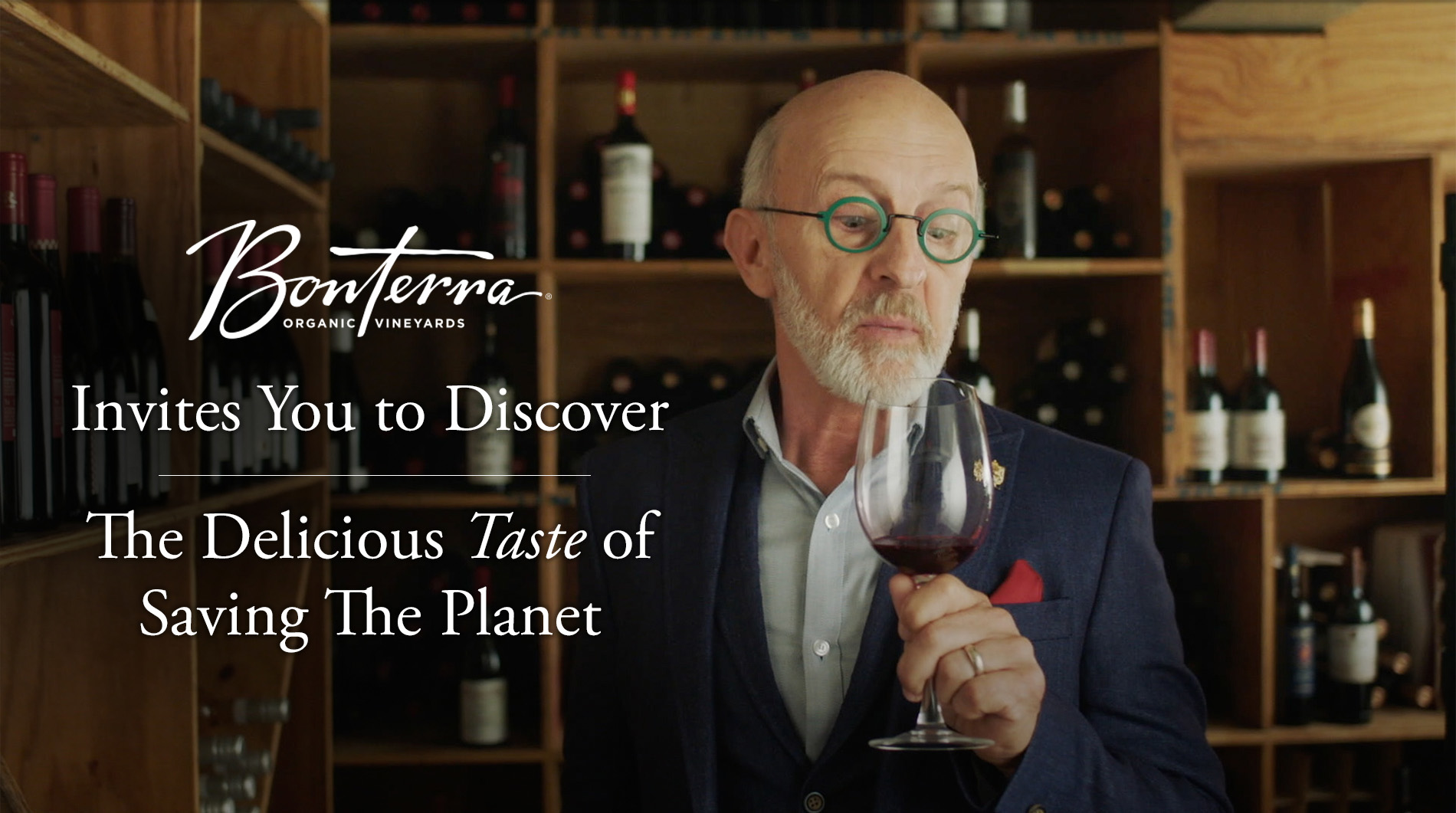 Banner of a man drinking wine that says Bonterra invites you to discover the delicious taste of saving the planet.