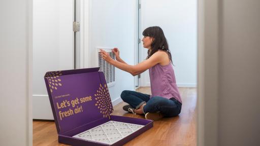 Woman installing air filters