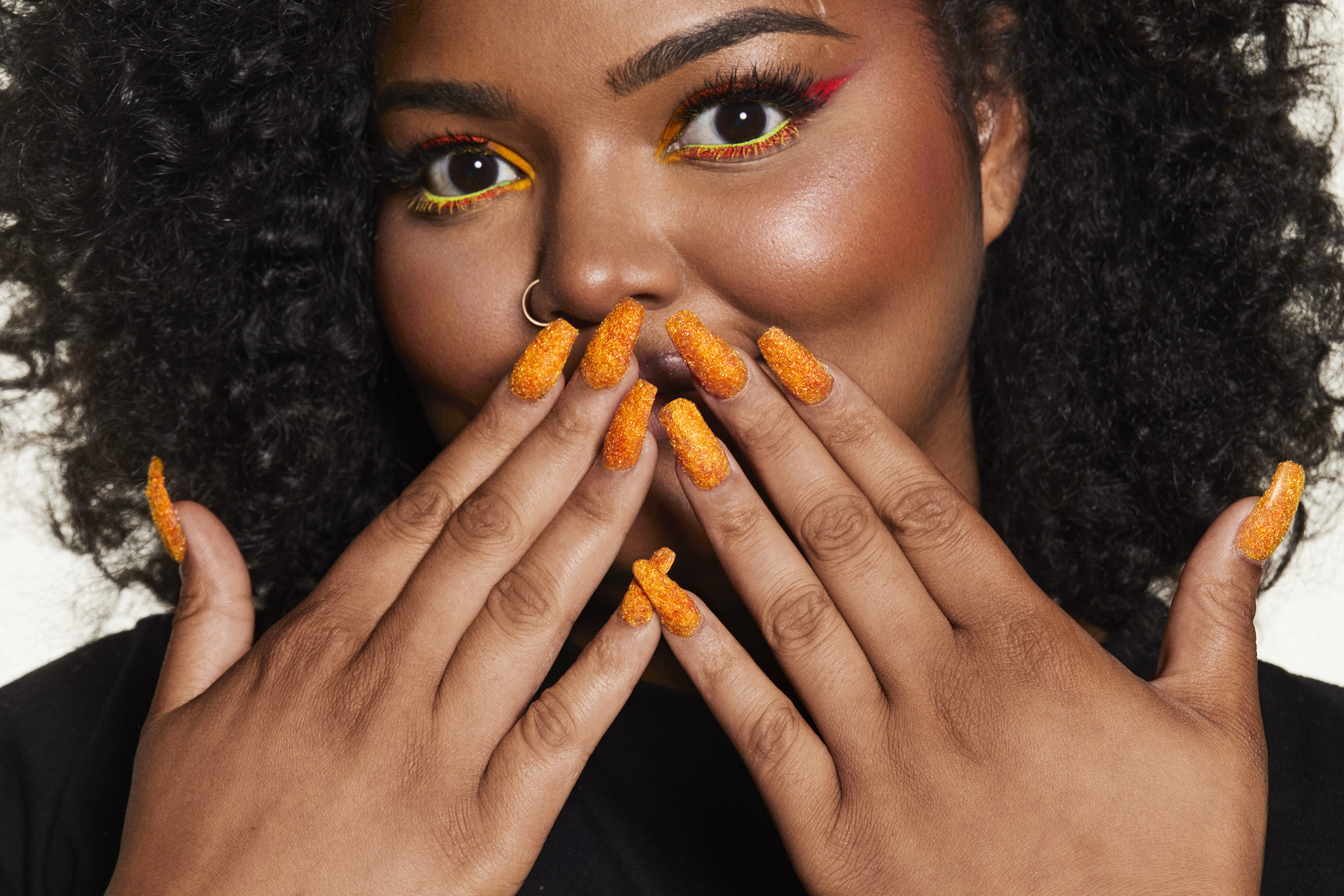 Cheetos puts its orange-dusted fingerprints all over fashion and beauty world with "House of Flamin' Haute"
