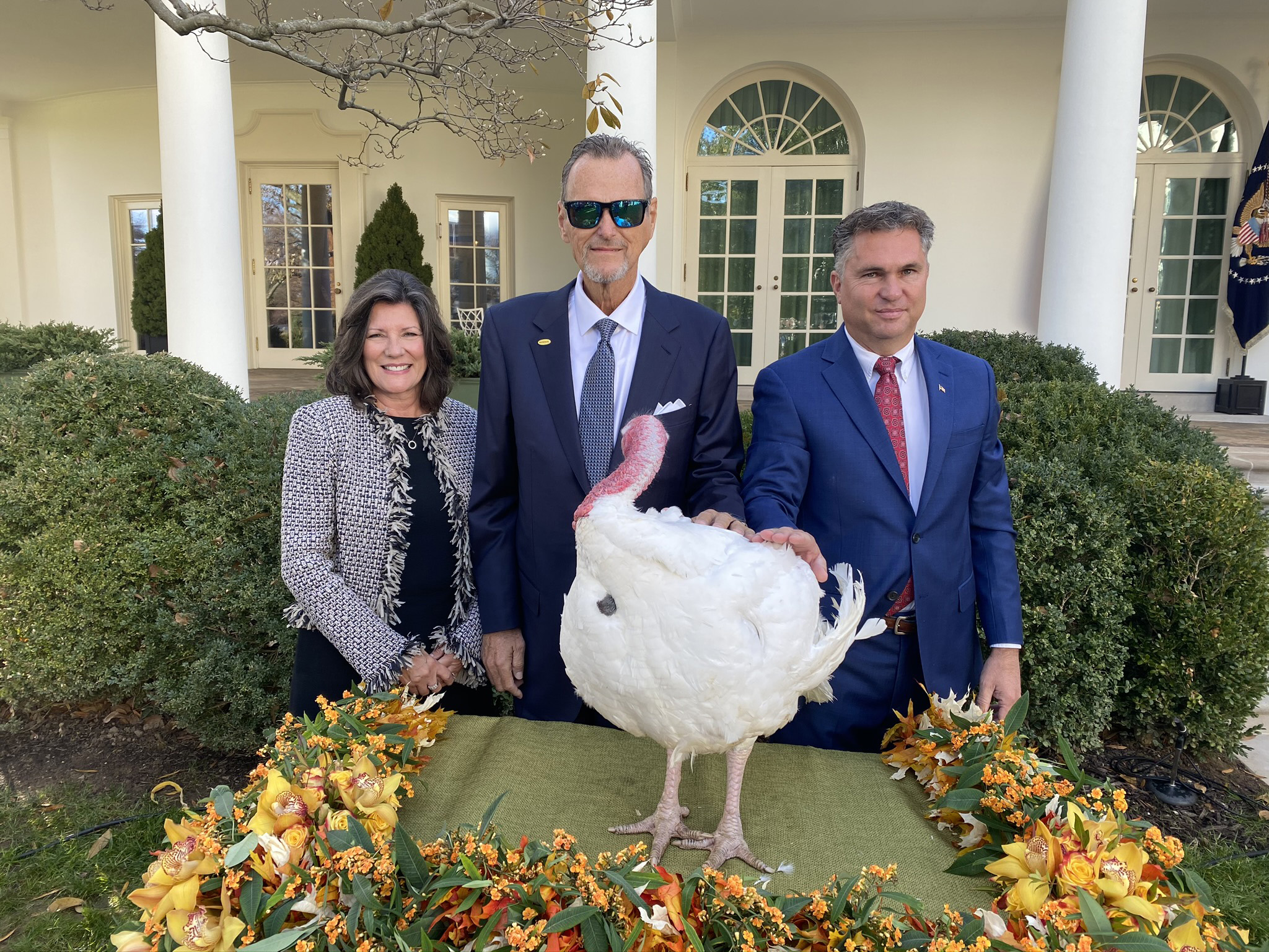 National Turkey Federation Chairman Kerry Doughty, his wife Jan and grower Wellie Jackson present Butter as the 2019 Presidential Turkey.