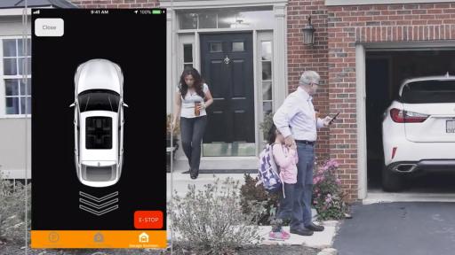 Family leaving house and backing car out of the garage with smart phone and app