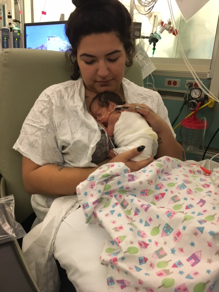 Aliyanna's mother, Daisy Martinez, holding her for the first time.