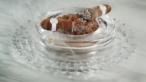 The CIGAR, The Mayfair Supper Club’s edible chocolate and hazelnut dessert showpiece that arrives hickory-smoked under a glass cloche.