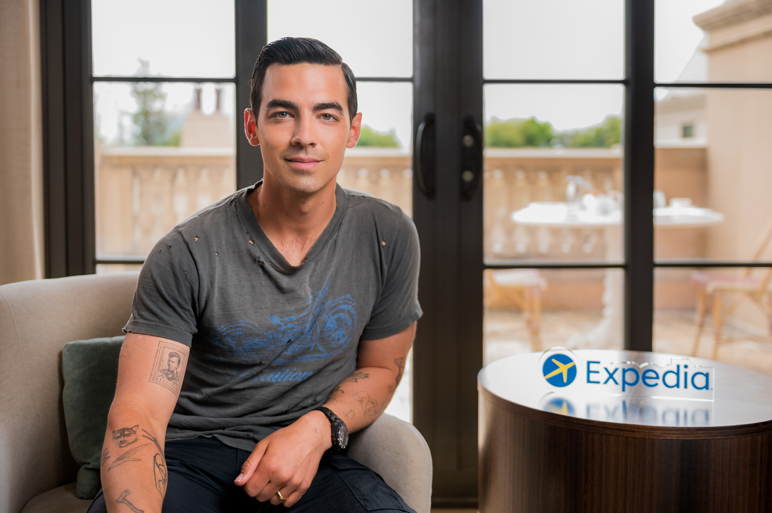Joe Jonas pictured on site with Expedia for an exciting project that will support travelers as they prepare to travel again