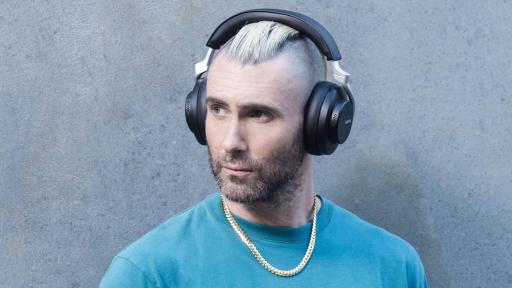 Adam Levine wearing Sure AONIC 50 Wireless Noise Cancelling Headphones