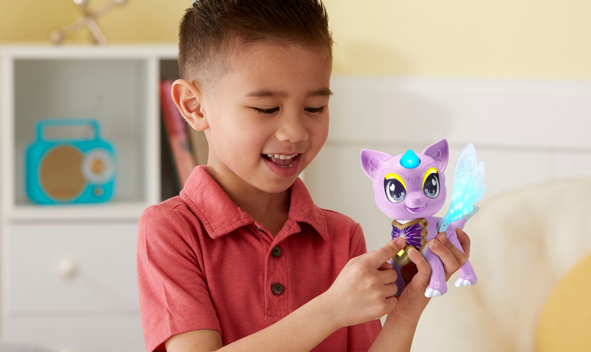 Young boy with a purple dragon toy