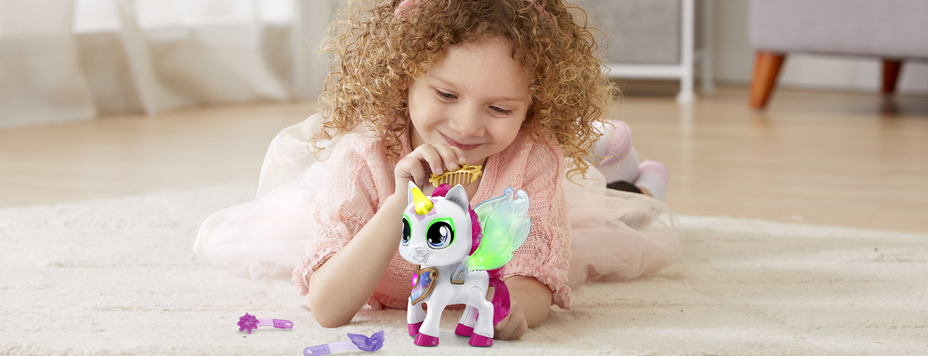 Little girl playing with a unicorn.