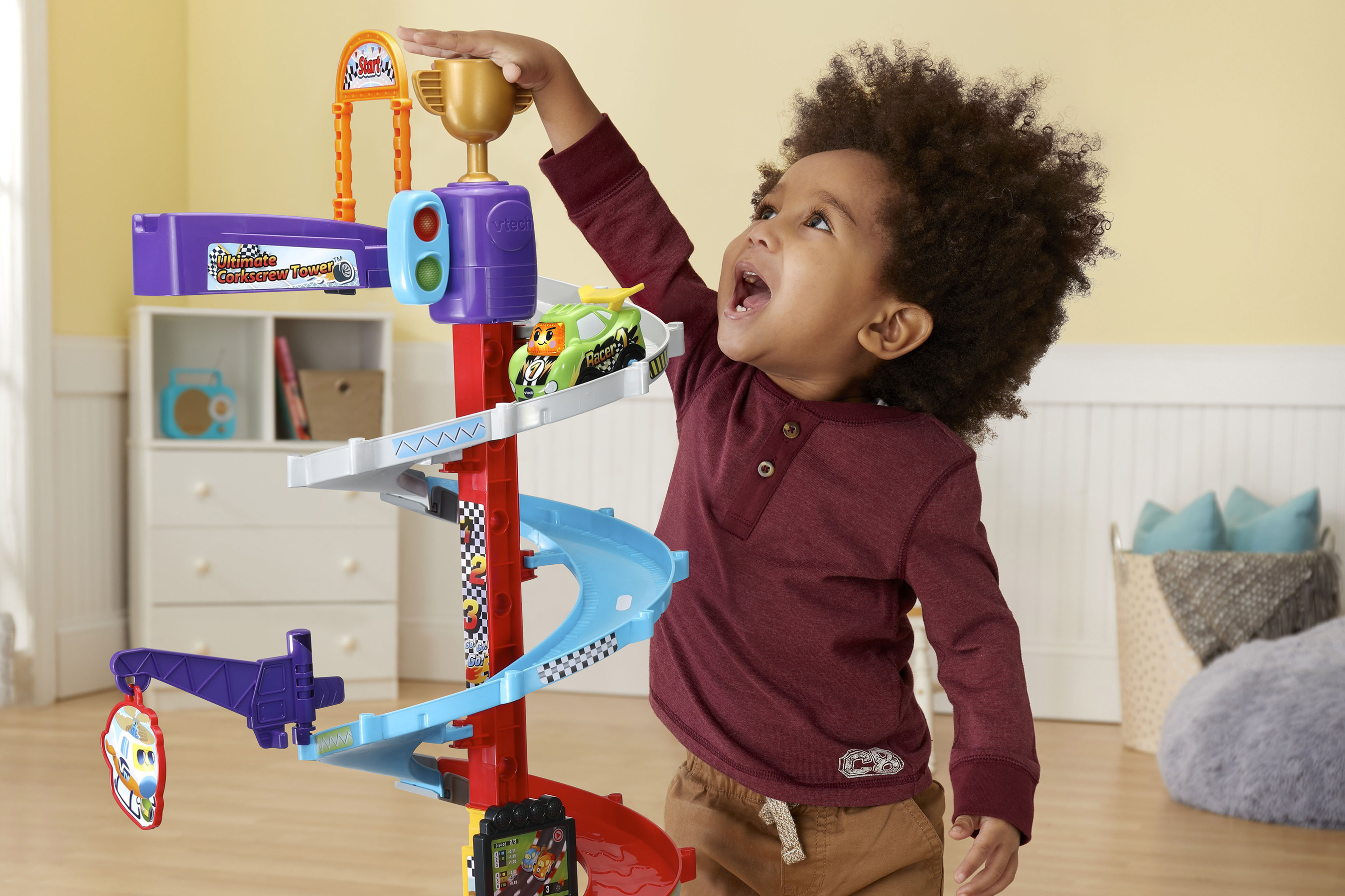 Kid playing with the VTech Ultimate Corkscrew Tower