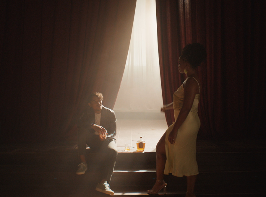 Man and woman on a stage drinking Crown Royal