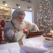 Santa looking at schematics