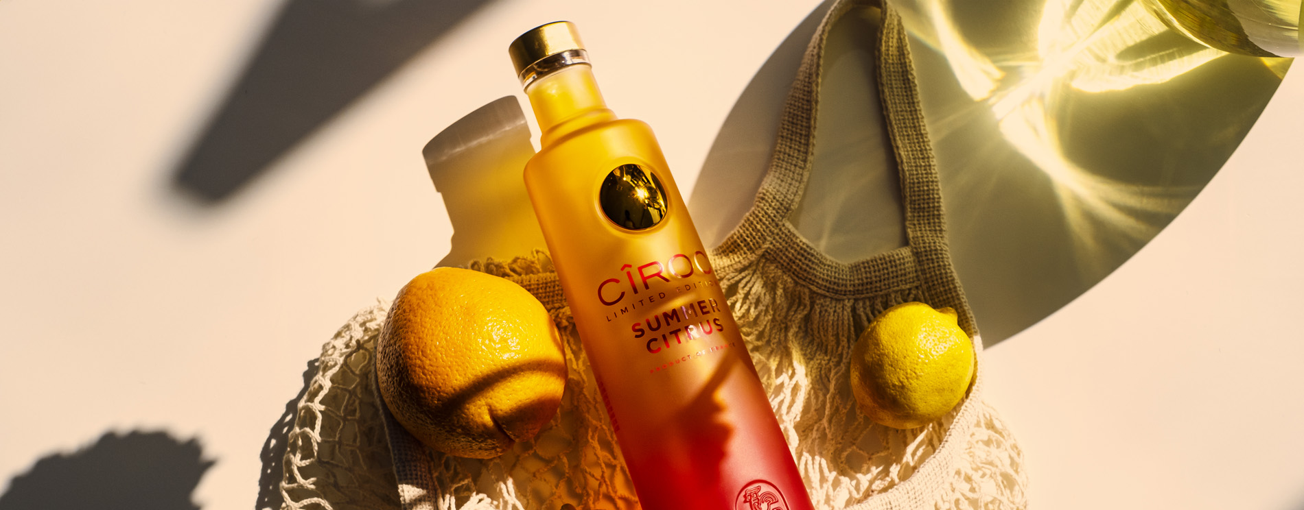 Cîroc Summer Citrus vodka in a bag of lemons