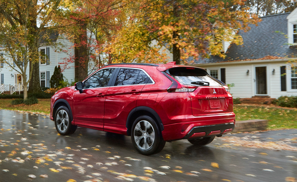 Red 2018 Mitsubishi Eclipse Cross Vehicles driving down a road